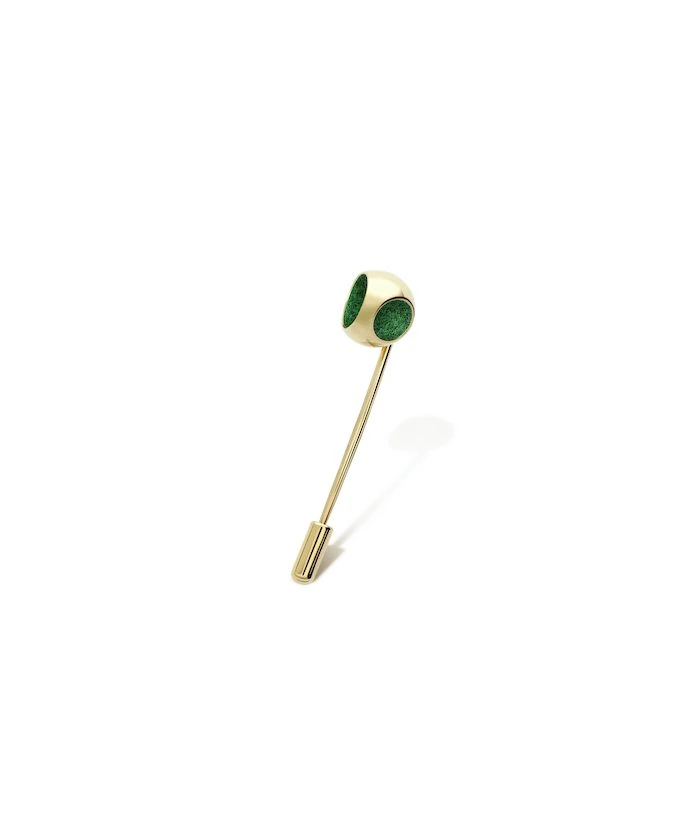 Gold lapel pin with green accents, perfect for adding a touch of sophistication to any attire.