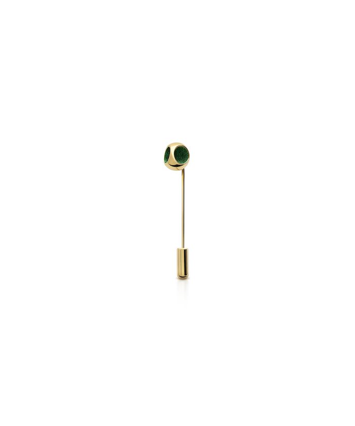 Stylish gold lapel pin featuring green decorative elements for fashion and accessories.
