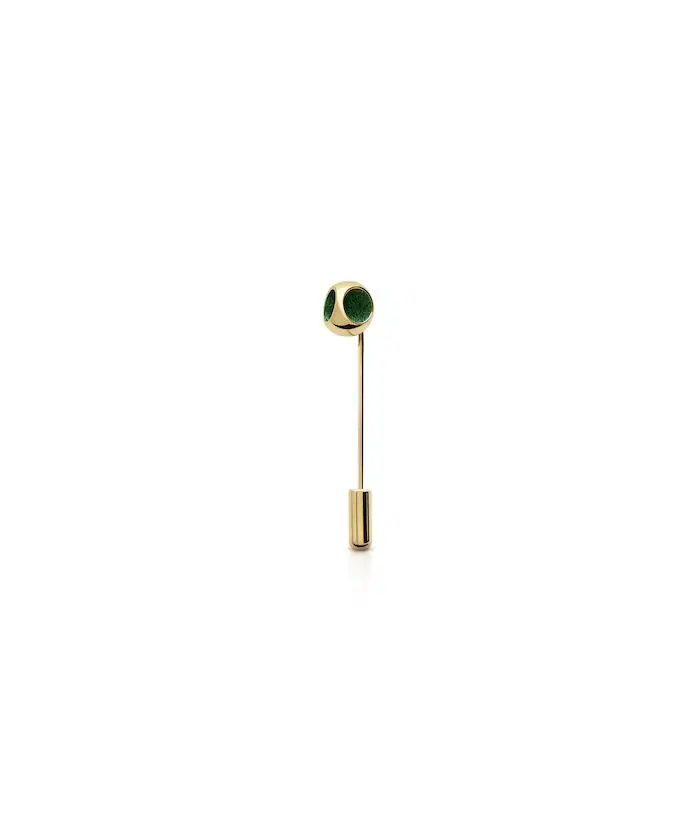 Stylish gold lapel pin featuring green decorative elements for fashion and accessories.