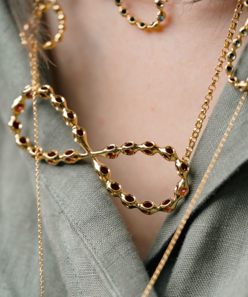 Infinito collection infinity necklaces worn layered