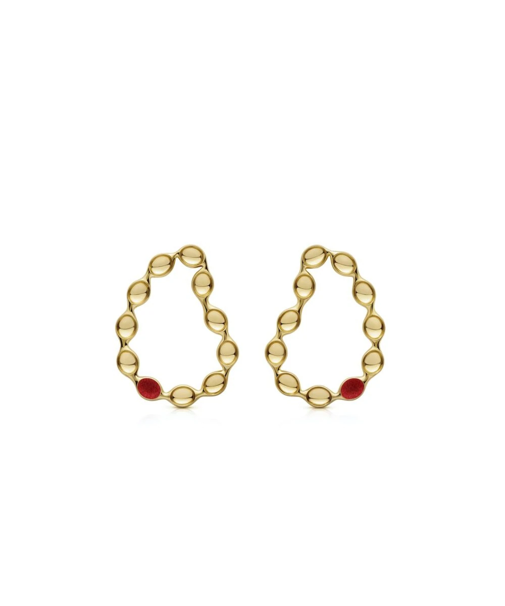 Elegant gold hoop earrings featuring playful red embellishments for a whimsical style.