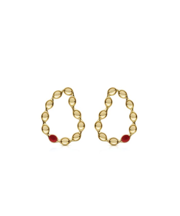 Elegant gold hoop earrings featuring playful red embellishments for a whimsical style.