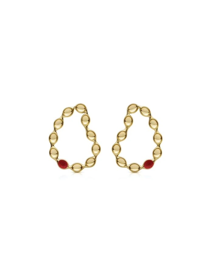 Elegant gold hoop earrings featuring playful red embellishments for a whimsical style.