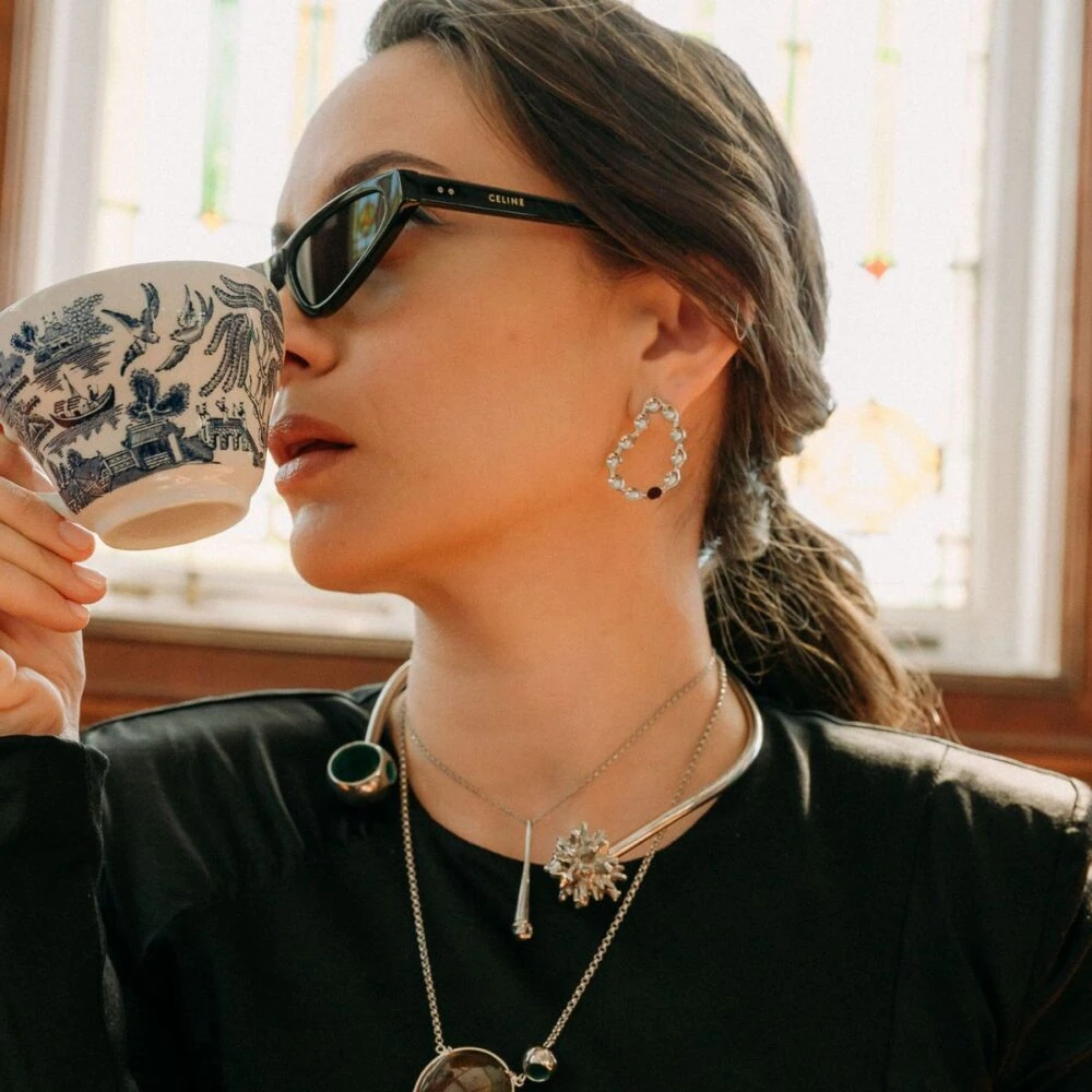 Delicate hoop earrings with clear gemstones, chic jewelry accessory.