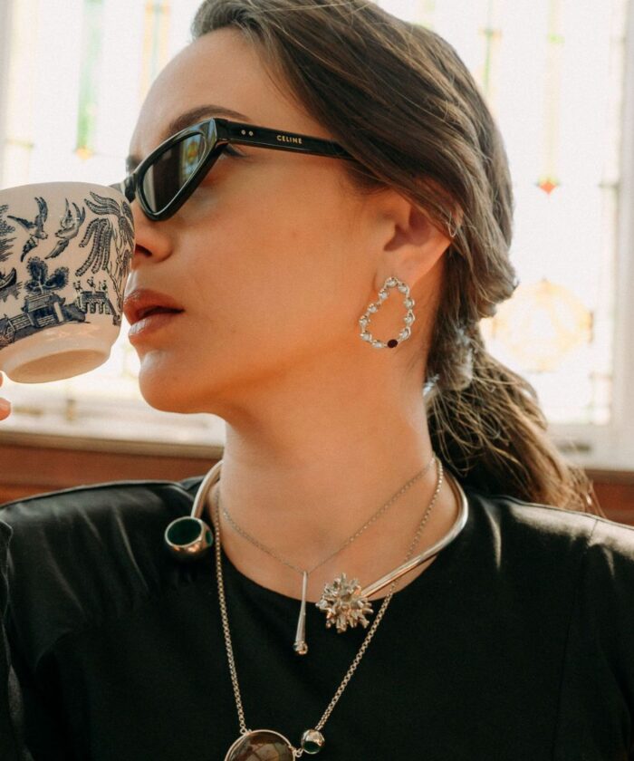 Delicate hoop earrings with clear gemstones, chic jewelry accessory.