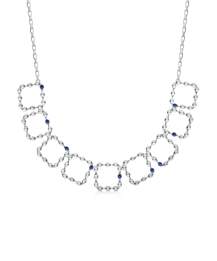 Elegant silver eternity necklace with interconnected hexagonal shapes and blue gemstone accents.
