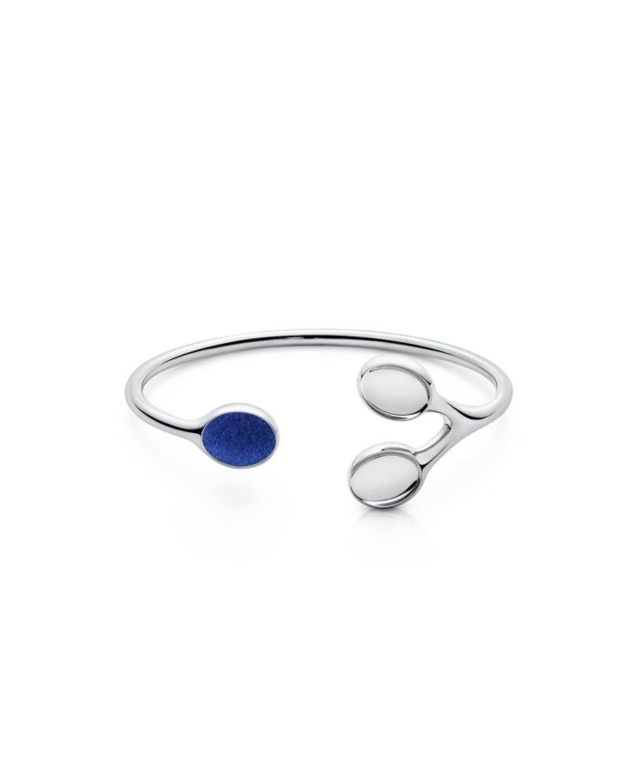 Elegant silver Trilogy Balance Bangle with contrasting blue and clear accents. Perfect for stylish, modern jewelry lovers.