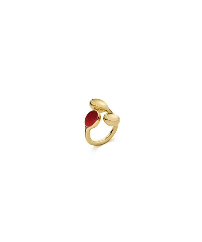 Elegant gold ring with red enamel accents, perfect for stylish occasions.