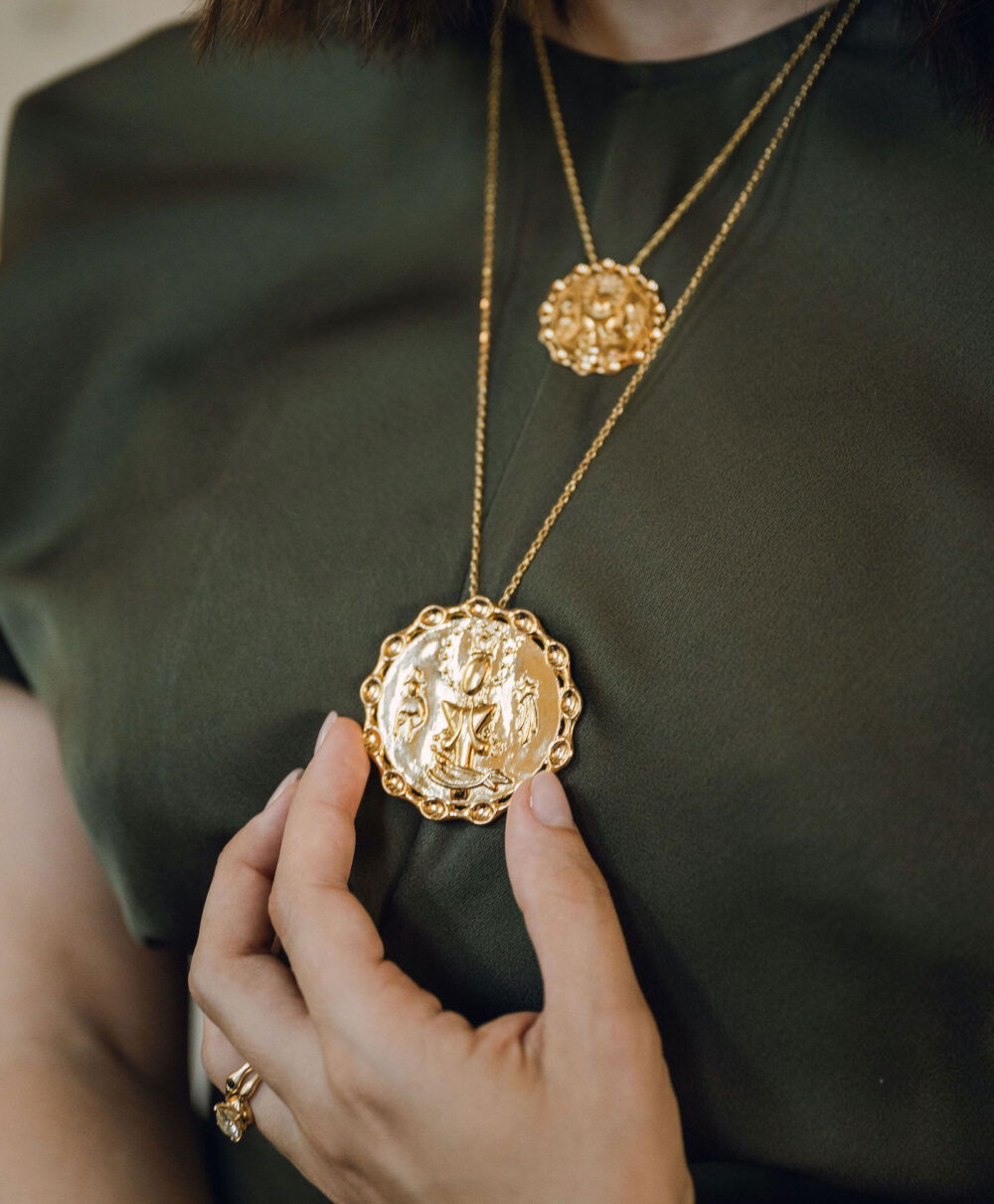 Gold Dominican Pendant with religious iconography. Perfect for cultural and spiritual jewelry lovers.