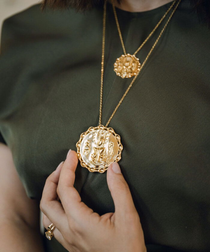 Gold Dominican Pendant with religious iconography. Perfect for cultural and spiritual jewelry lovers.