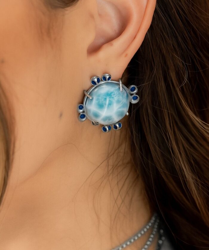 Beautiful Larimar gemstone earring with blue detailing, perfect for stylish jewelry lovers.