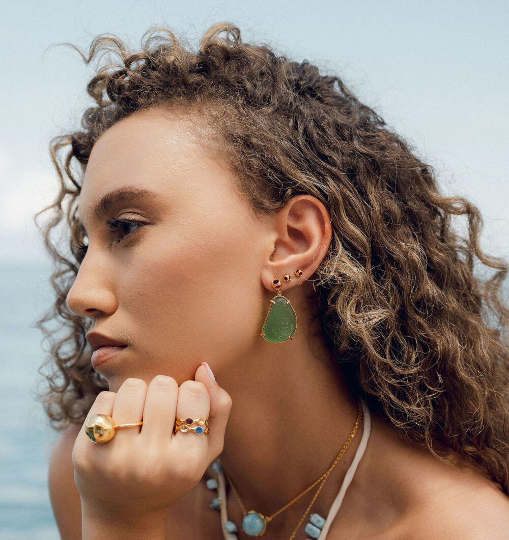 Elegant sea glass earrings with gold accents and natural coastal charm.