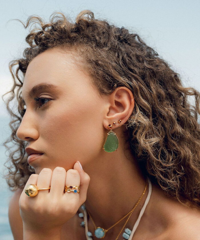 Elegant sea glass earrings with gold accents and natural coastal charm.