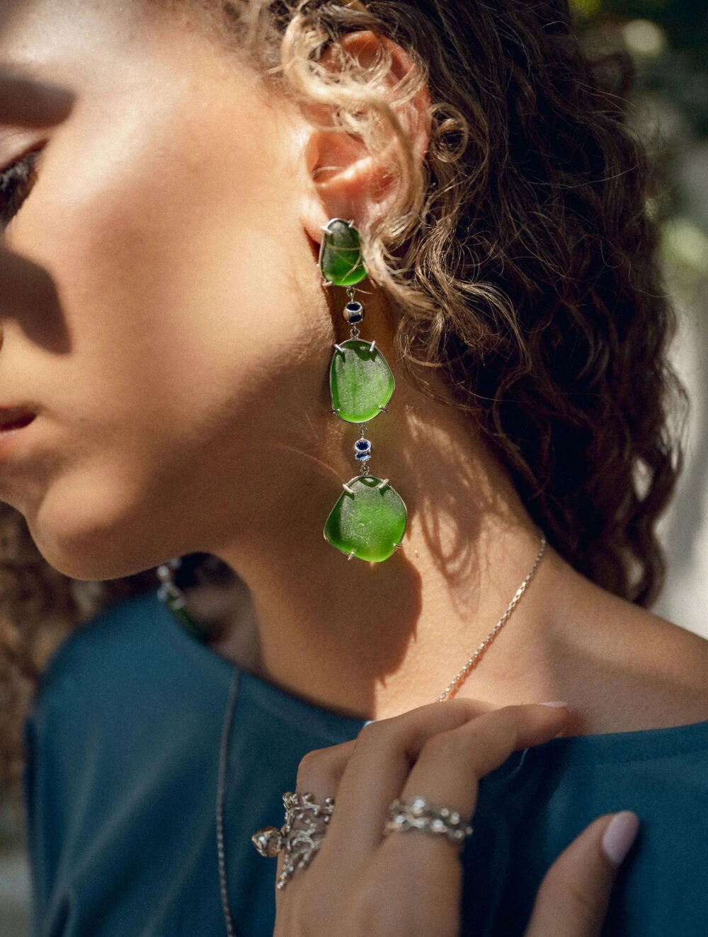 Elegant sea glass earrings with vibrant green stones, perfect for beach-inspired jewelry lovers.