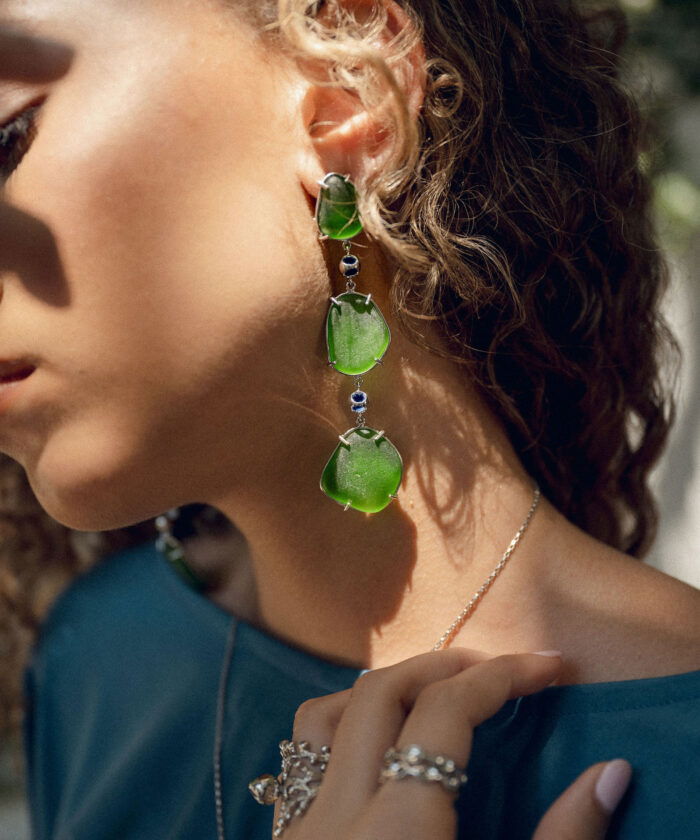 Elegant sea glass earrings with vibrant green stones, perfect for beach-inspired jewelry lovers.