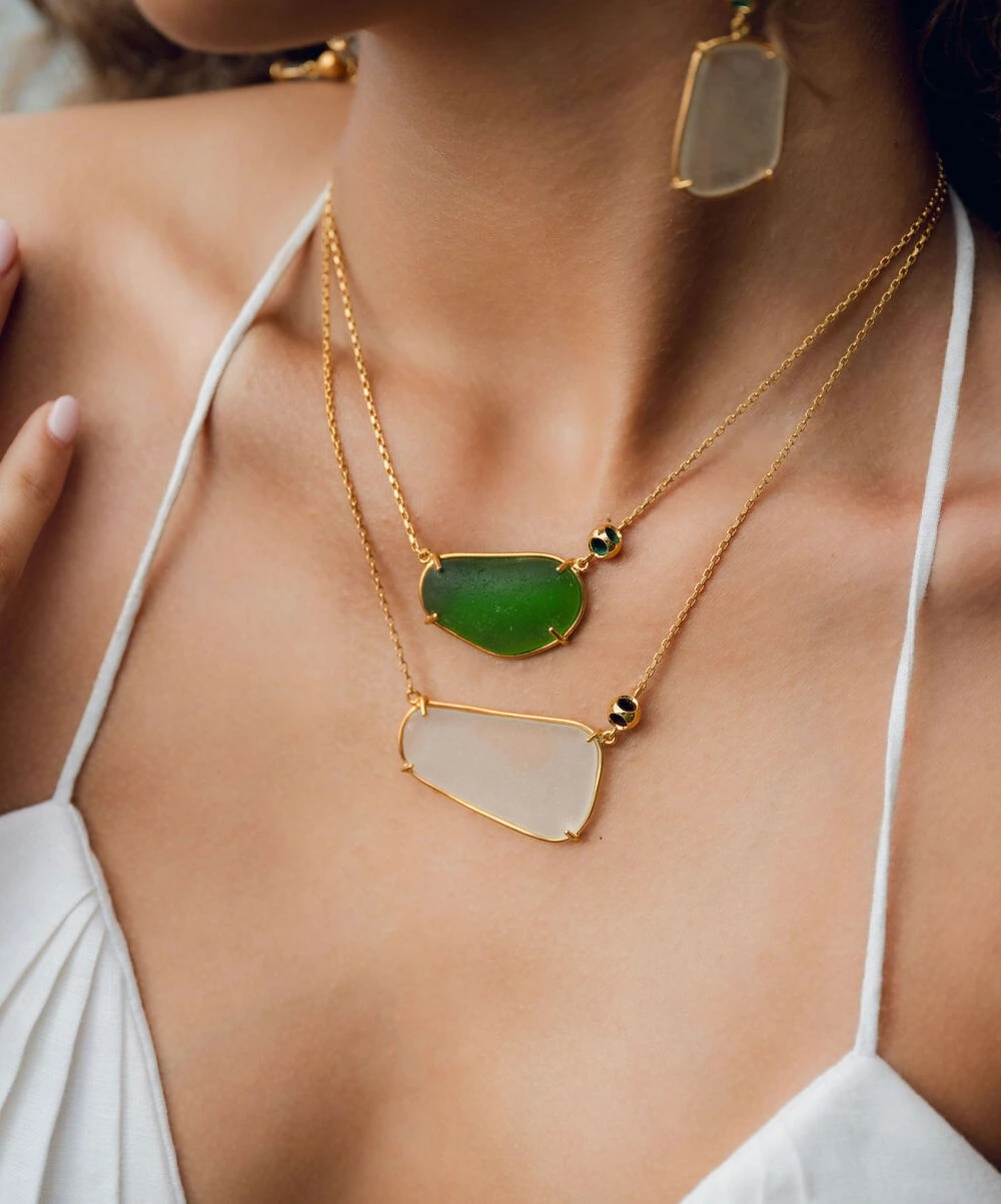 Bright green and white frosted glass jewelry with gold accents. Stylish and unique accessories.