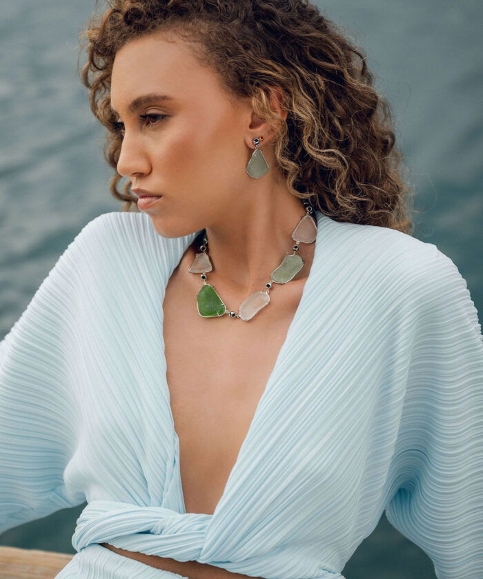 Elegant sea glass jewelry set in varied ocean-inspired shades.