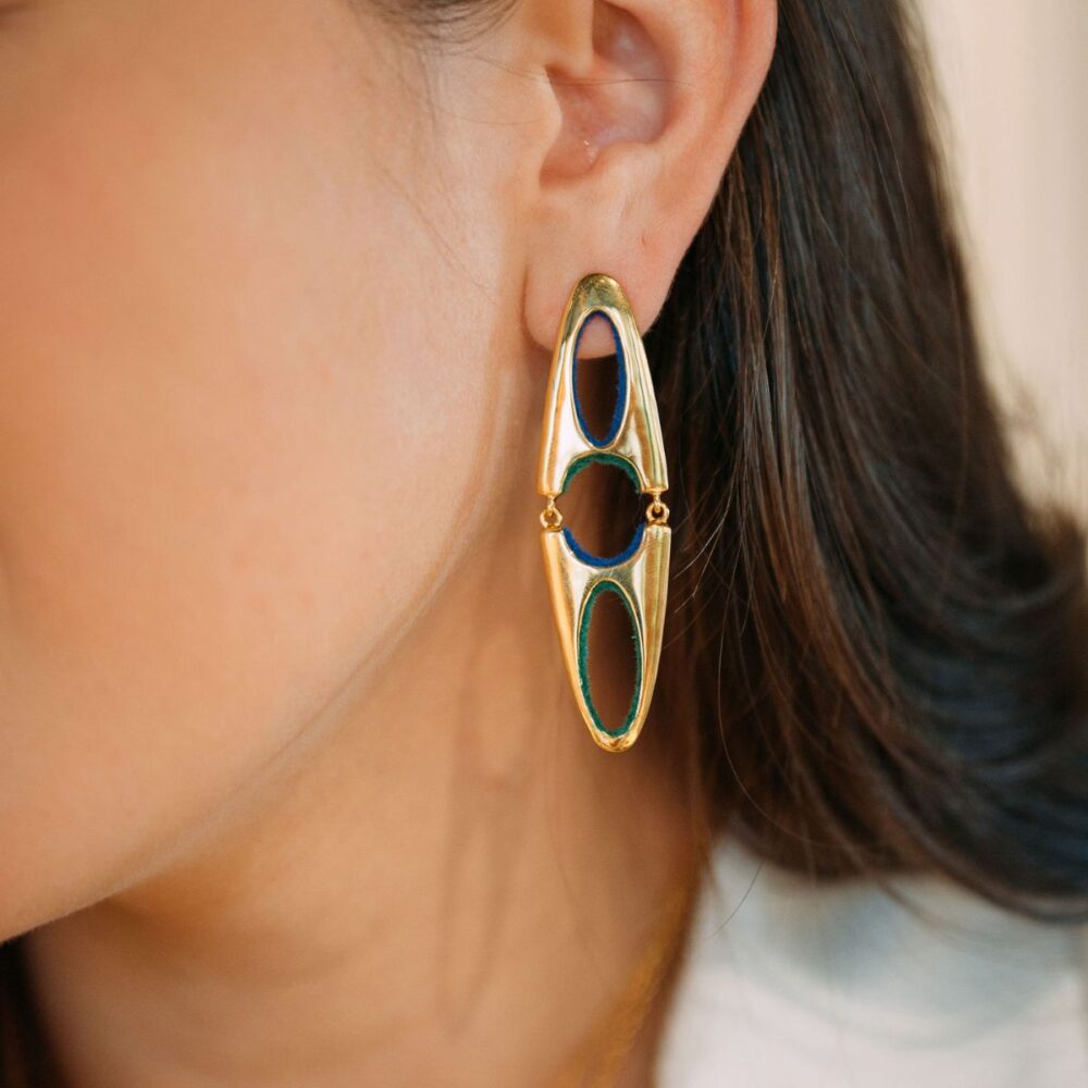 Bright, fashionable gold earrings with abstract cutouts, enhancing any sophisticated outfit.