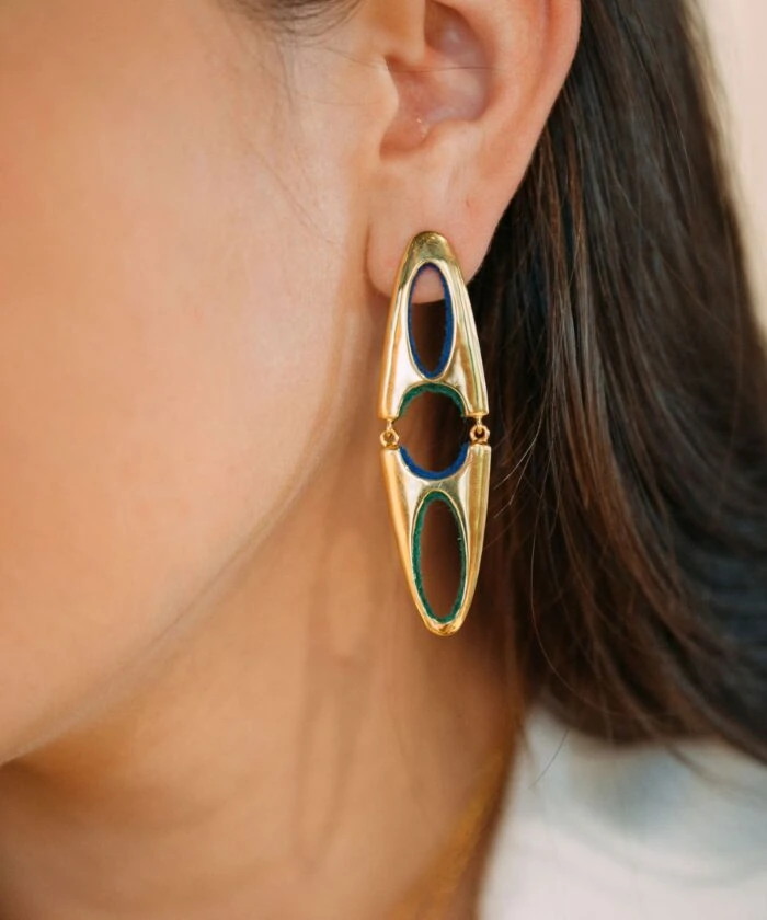Bright, fashionable gold earrings with abstract cutouts, enhancing any sophisticated outfit.