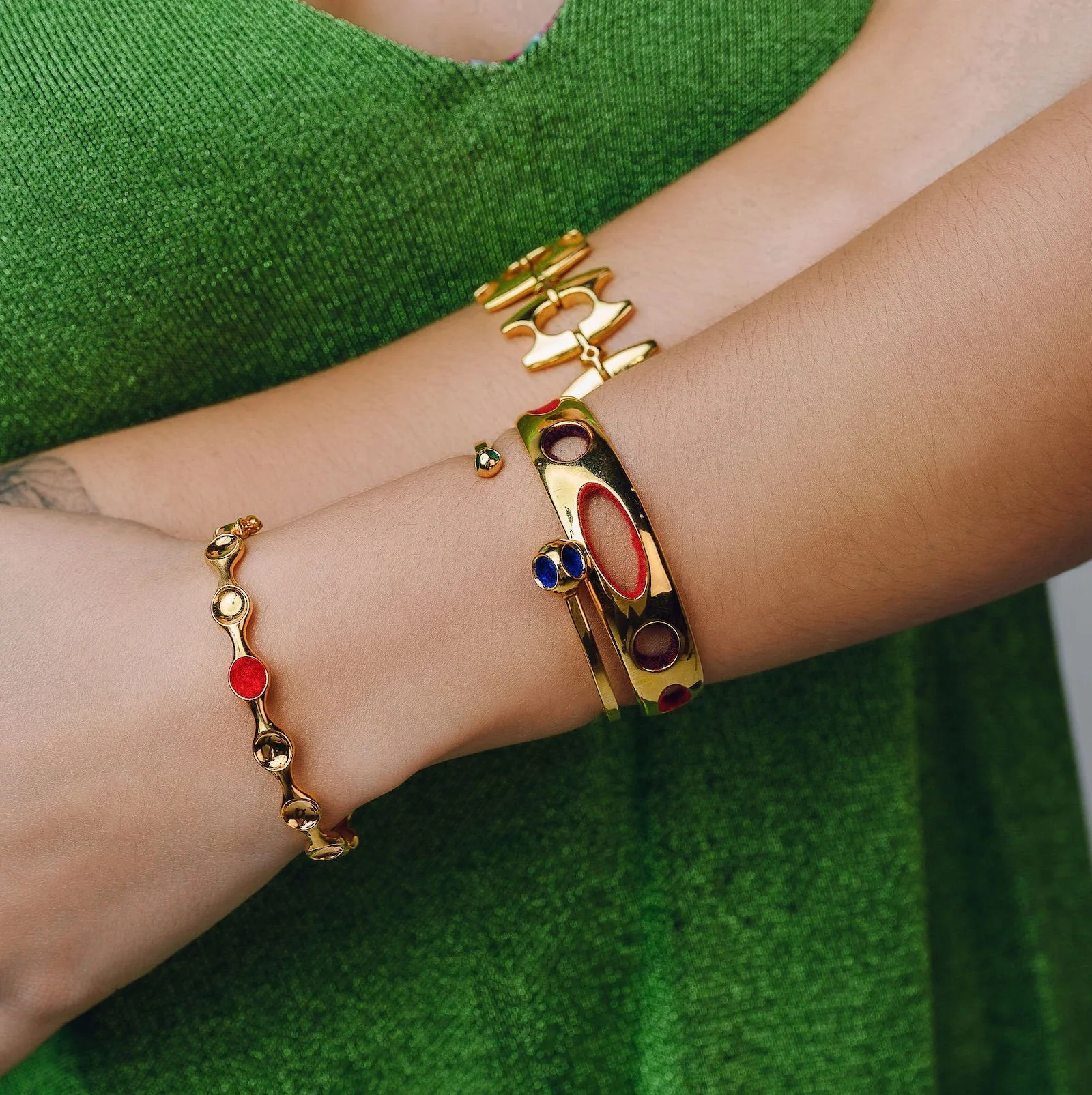 Enameled Gold Bracelet with Cutouts EvelynAnn gold cuff bracelet with colorful cutout design, perfect for stylish accessories.