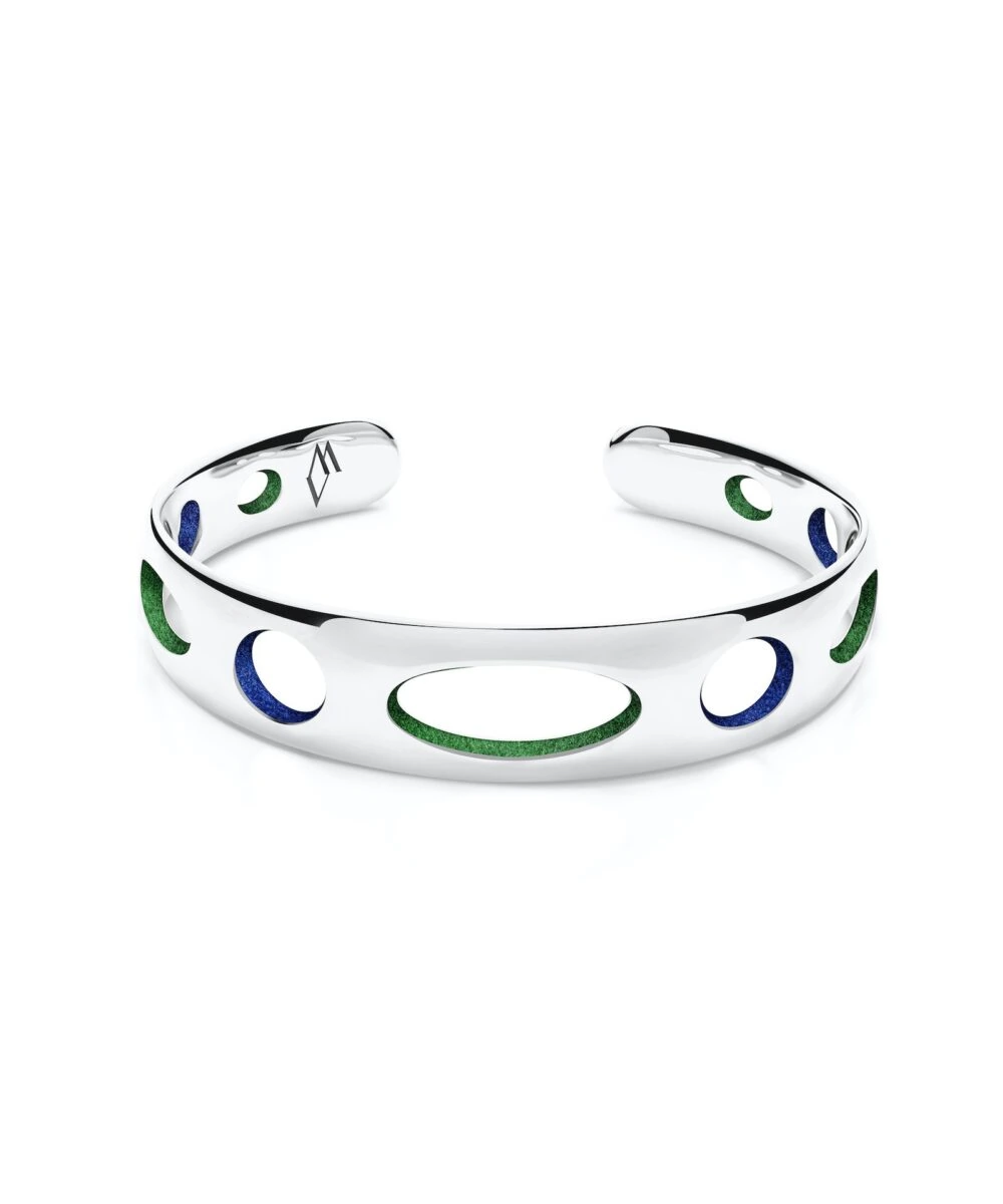 Elegant silver cuff bracelet with green and blue enamel circles, modern accessory for stylish outfits.