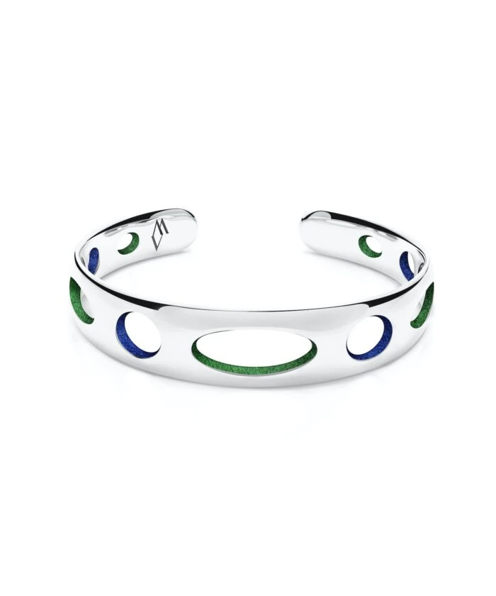 Elegant silver cuff bracelet with green and blue enamel circles, modern accessory for stylish outfits.