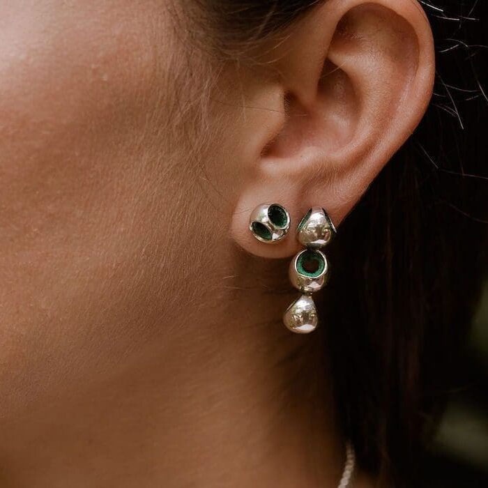 Gold and emerald drop earrings for women, stylish jewelry for special occasions.