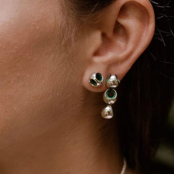 Gold and emerald drop earrings for women, stylish jewelry for special occasions.