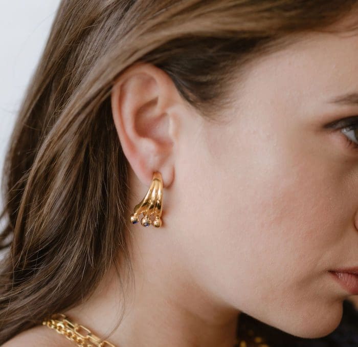 Elegant gold earrings with cubic zirconia stones, perfect for stylish women.