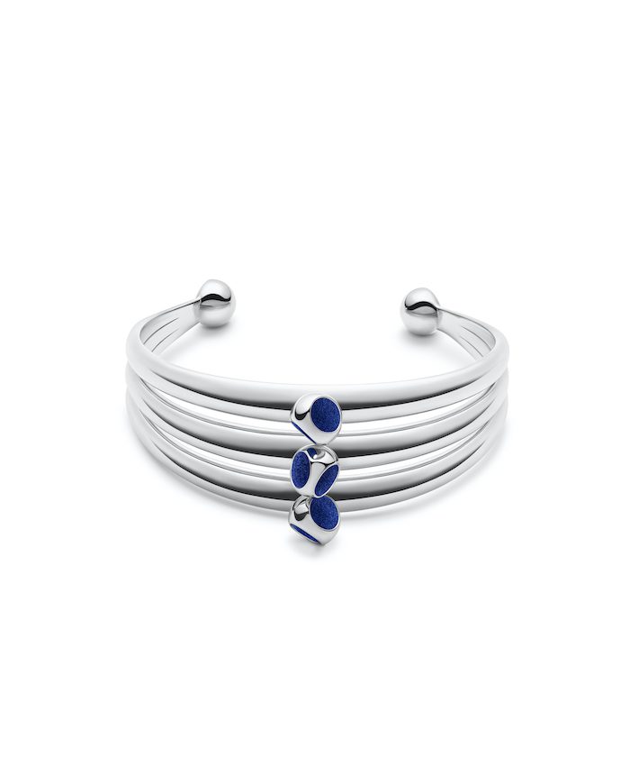 Sterling silver cuff with blue accents, stylish and elegant accessory.