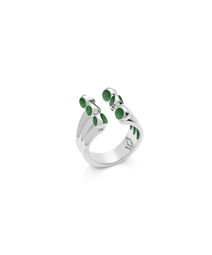 Elegant silver ring with green accents, perfect for stylish jewelry lovers.