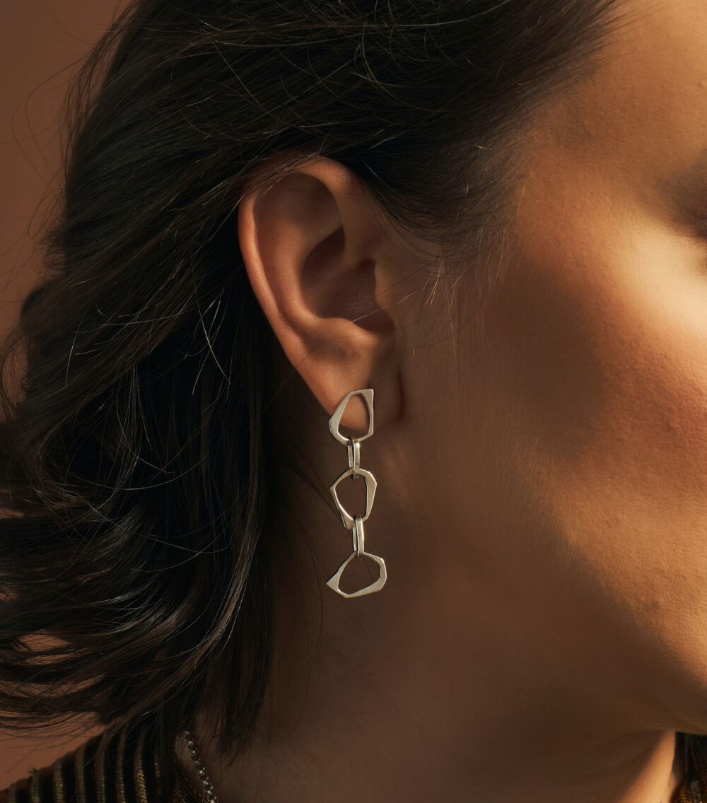 Stylish silver geometric earrings by Monica Varela, perfect for modern fashion.