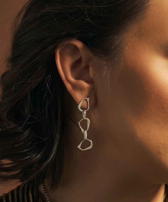 Stylish silver geometric earrings by Monica Varela, perfect for modern fashion.
