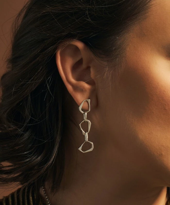 Stylish silver geometric earrings by Monica Varela, perfect for modern fashion.