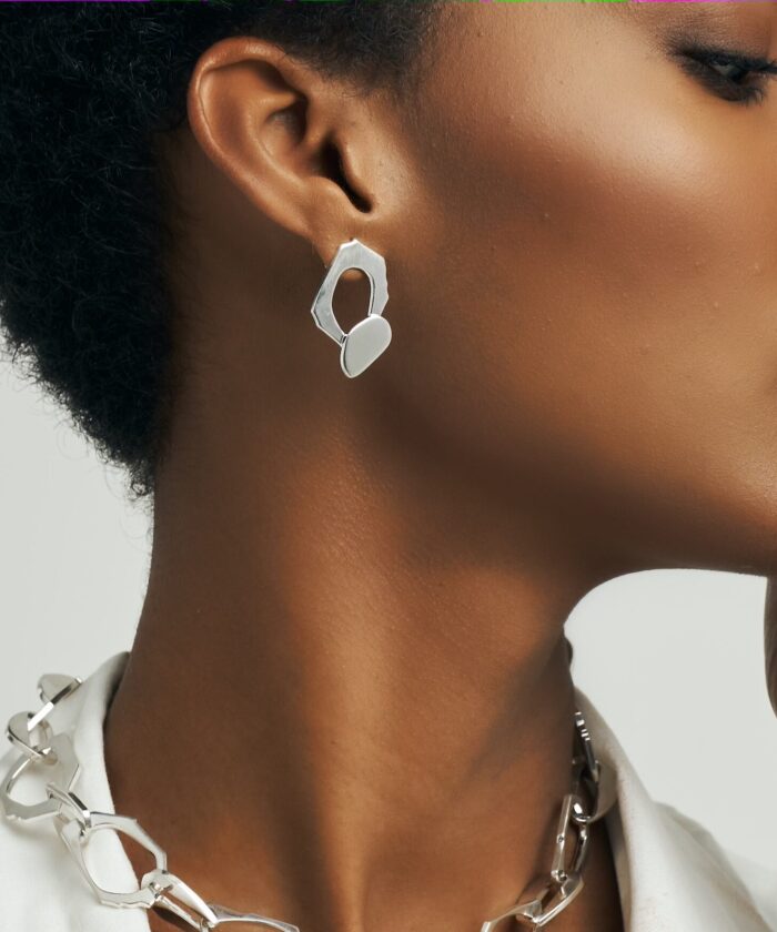 Sharp, modern jewelry design with a sleek silver finish.