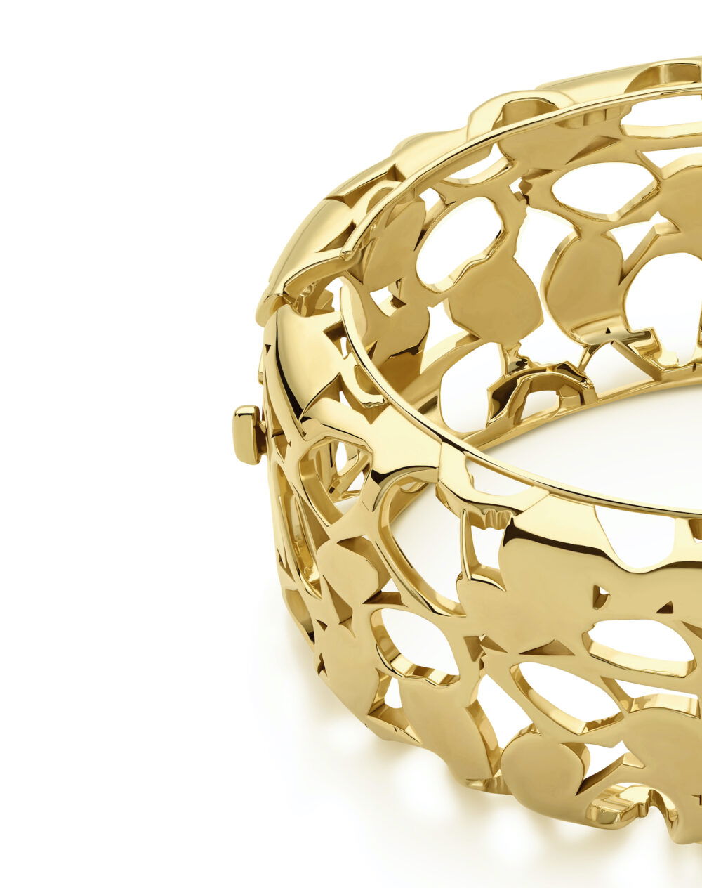 Gorgeous gold heritage bangle with intricate openwork design, perfect for stylish accessories.