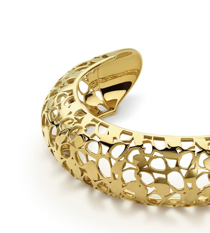 Gold openwork cuff bracelet, elegant jewelry piece by Monica Varela.