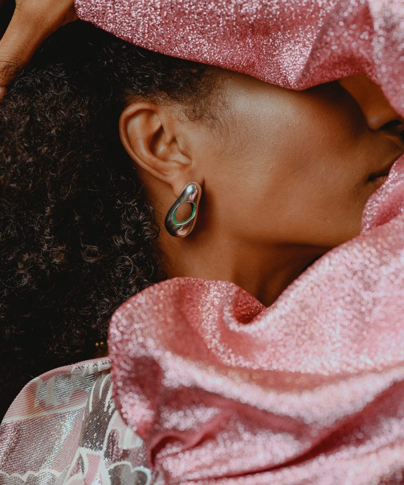 Esli collection gold earring worn by model in pink