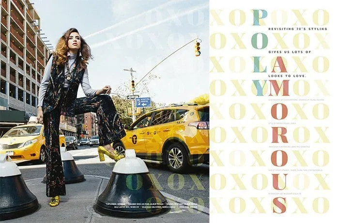 Stylish woman in city street with taxis.