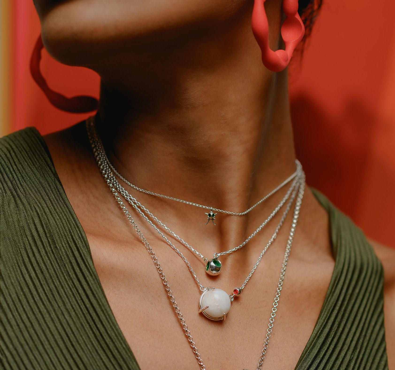 Layered pendant necklaces of different lengths on model, sizing guide
