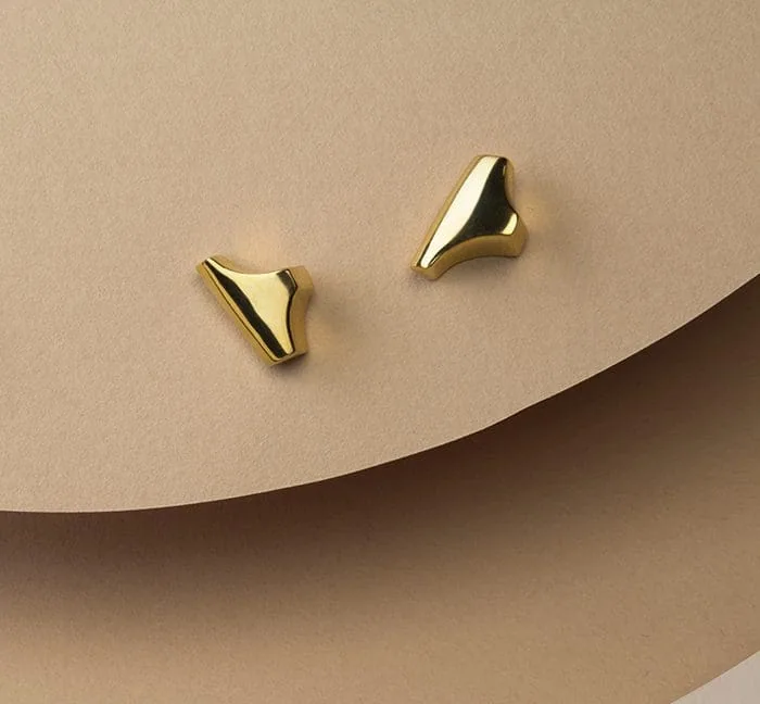 Gold Tannier stud earrings with sleek, modern design.