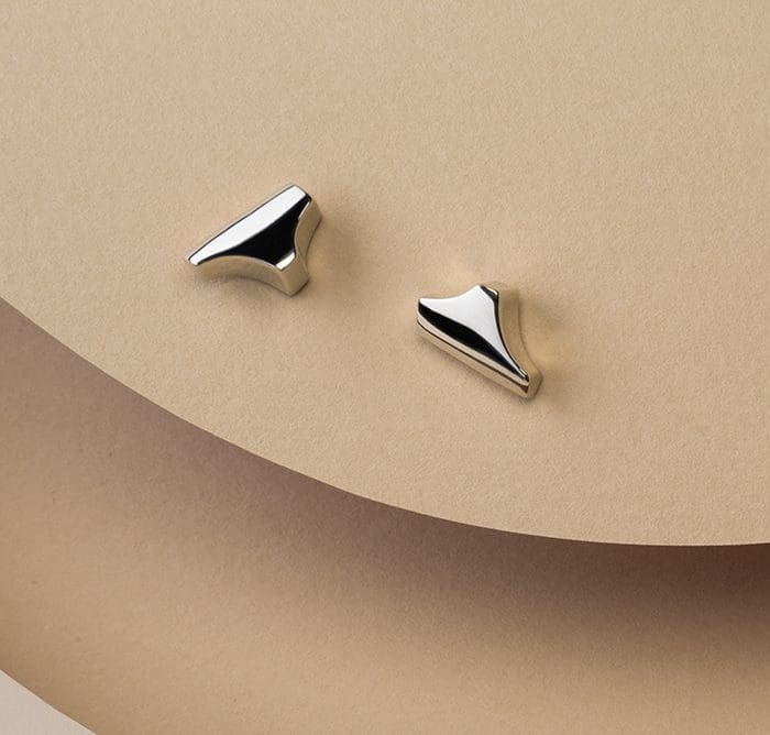 Elegant silver Tannier stud earrings for a chic look. Perfect for everyday or special occasions.