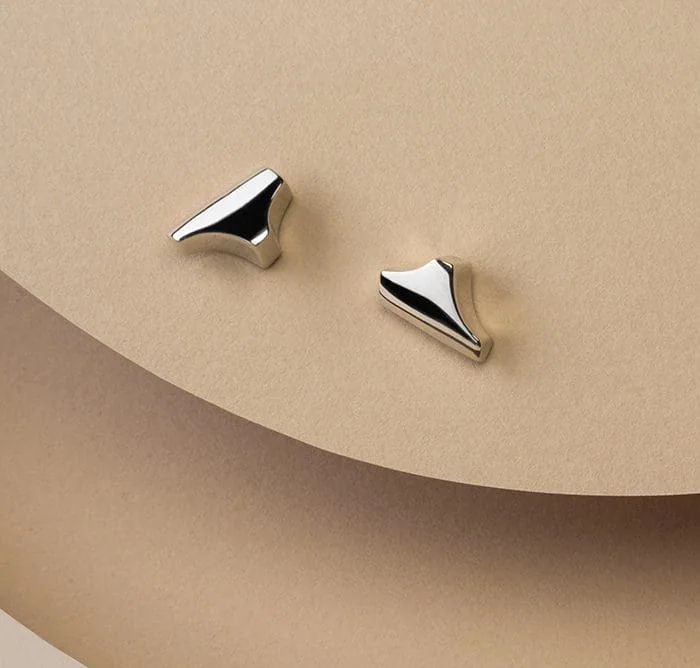 Elegant silver Tannier stud earrings for a chic look. Perfect for everyday or special occasions.