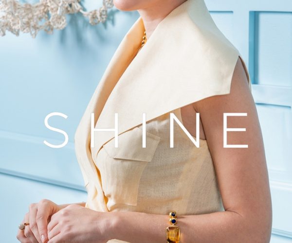 Model in a cream suit on the Shine magazine feature