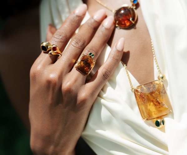 Dominican amber pendant and rings worn by model