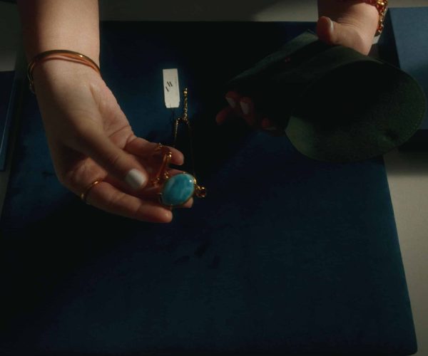 Jewelry being placed in reusable Monica Varela packaging
