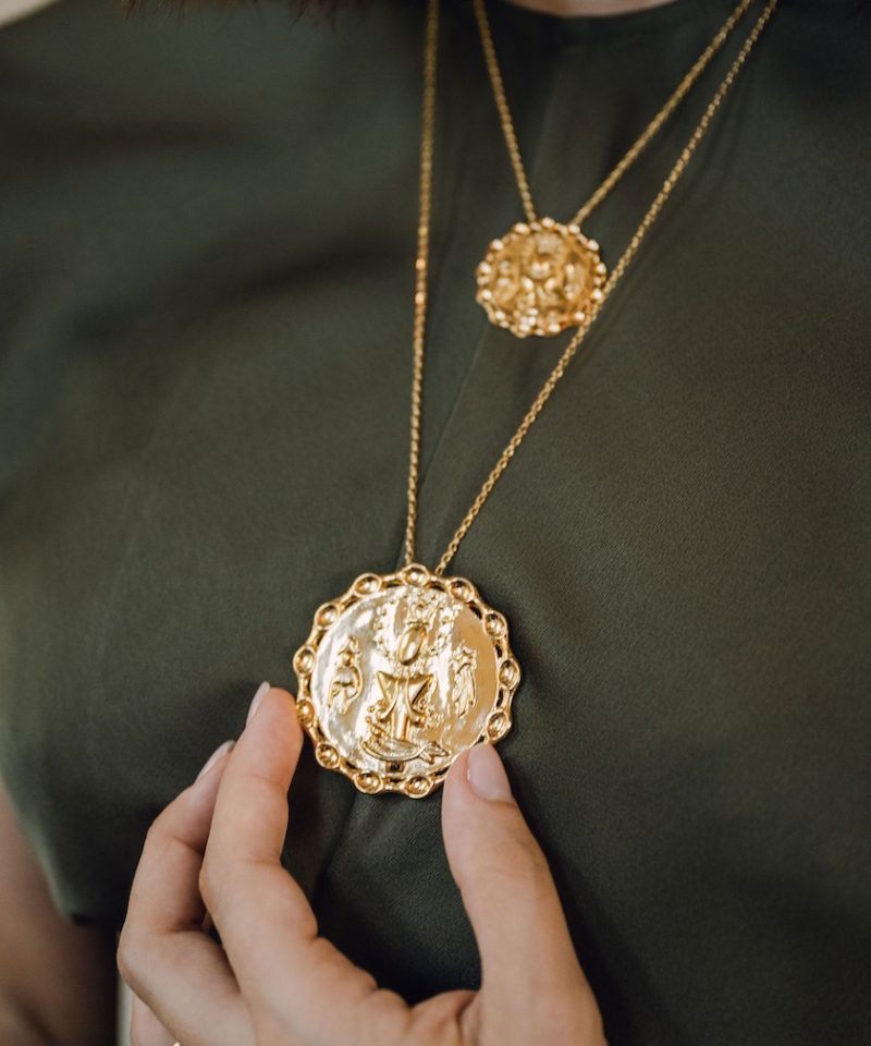 Divine Reflections Altagracia medallion necklaces worn layered