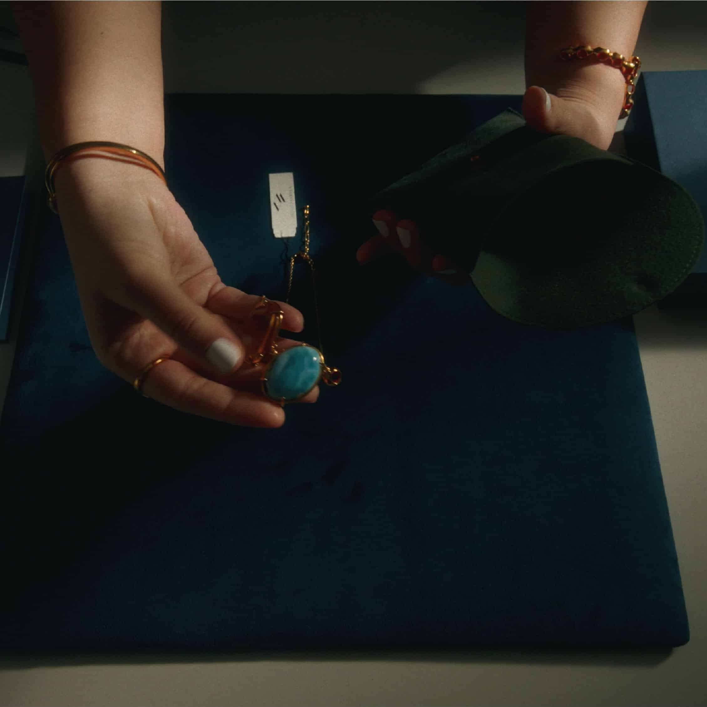 Jewelry being placed in reusable Monica Varela packaging