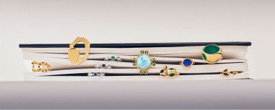 Monica Varela rings of different sizes displayed on a shelf