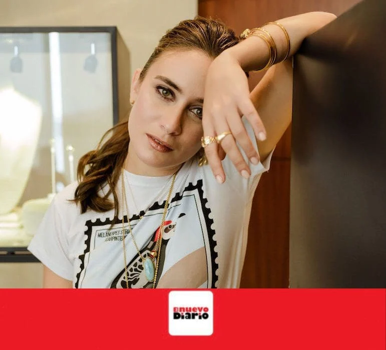 Close-up of Monica Varela with captivating eye contact and stylish jewelry.